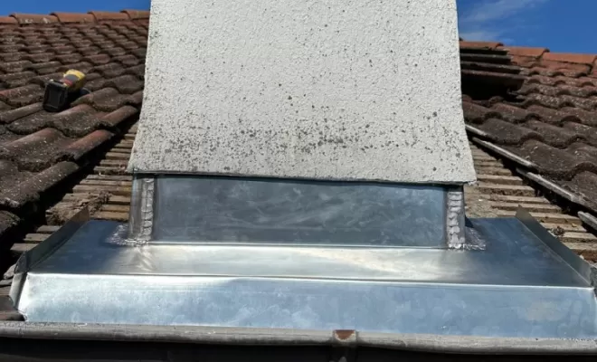 Abergement de cheminée en zinc sur mesure à Montluçon.